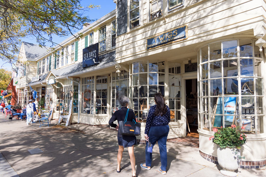 people walking around downtown Falmouth near shops