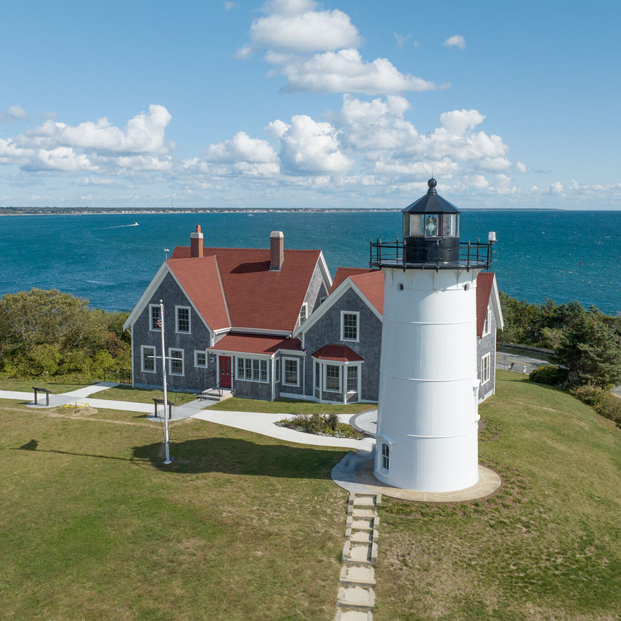 aerial view of lighthouse and museum on cape cod coast