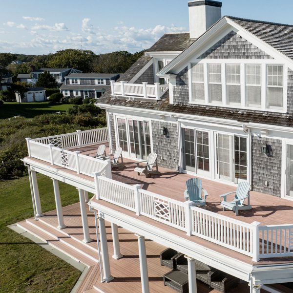 vacation home with multiple stories and wrap around porches on Cape Cod