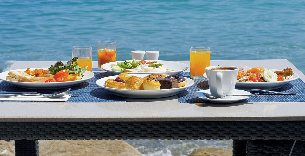 outdoor table with food at seaside restaurant near Mashpee MA
